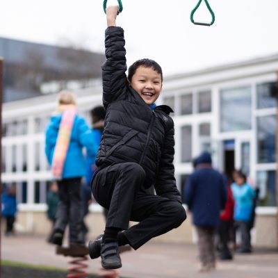Child hanging from hoop
