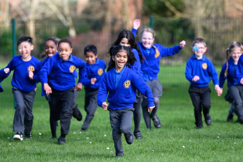 Children running on field